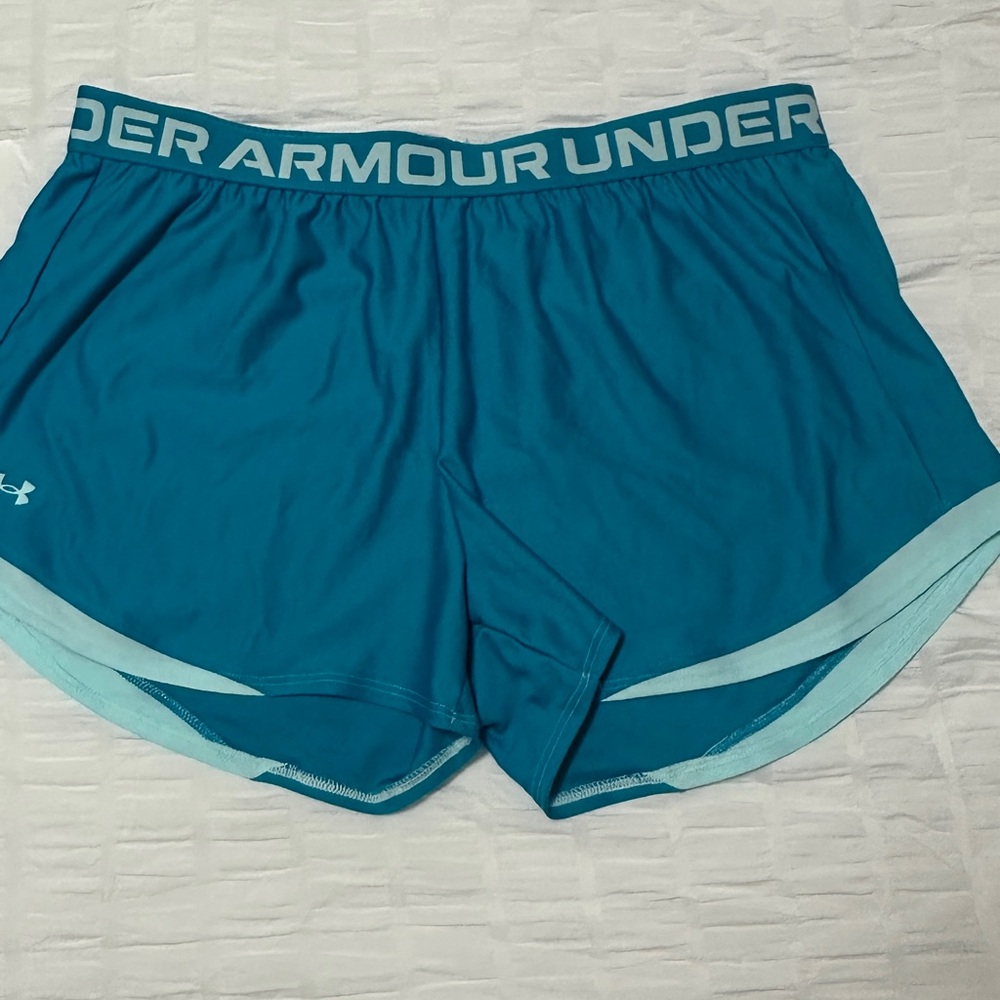 Under Armour women’s athletic shirts XL. Never worn